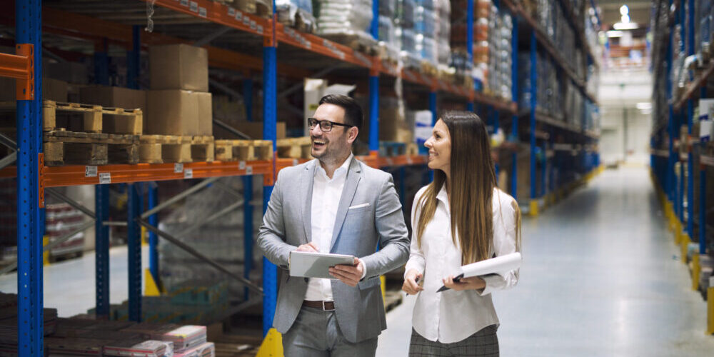 Warehouse workers discussing logistics and distribution – Easylife Tech team planning inventory flow, supply chain strategy, and order fulfillment operations