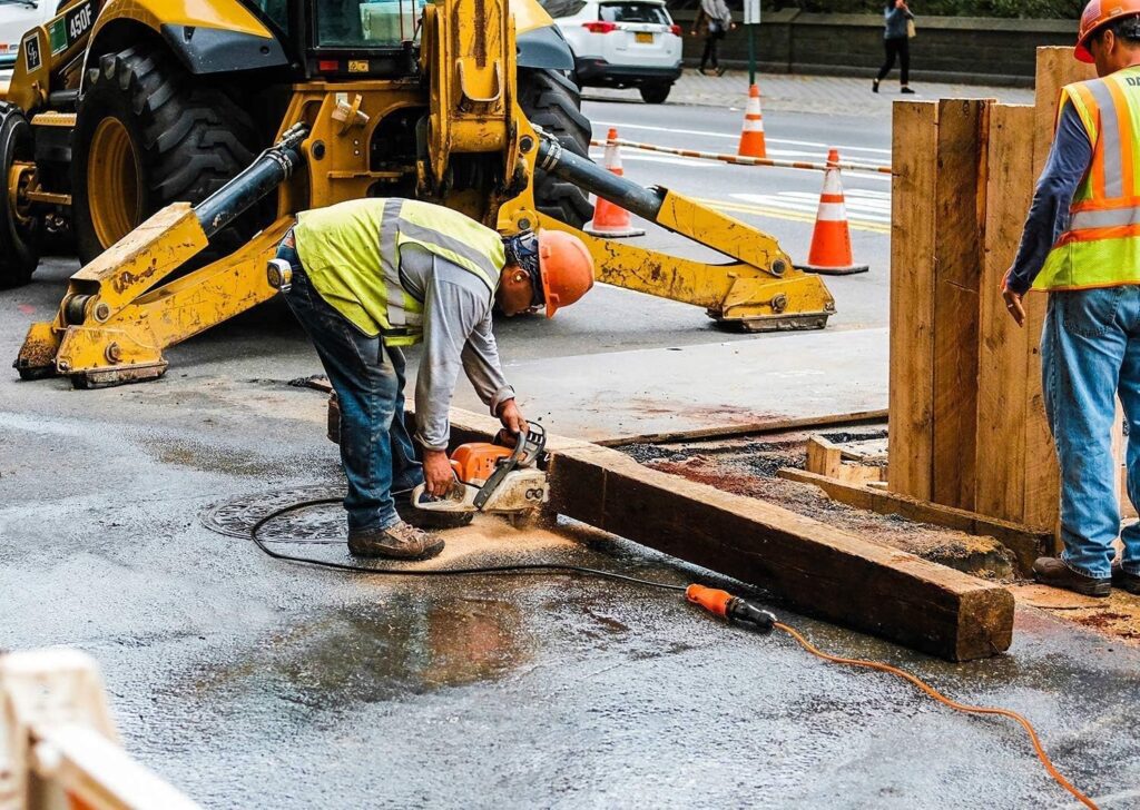 Heavy-duty outdoor extension cord powering construction equipment safely in wet outdoor jobsite conditions